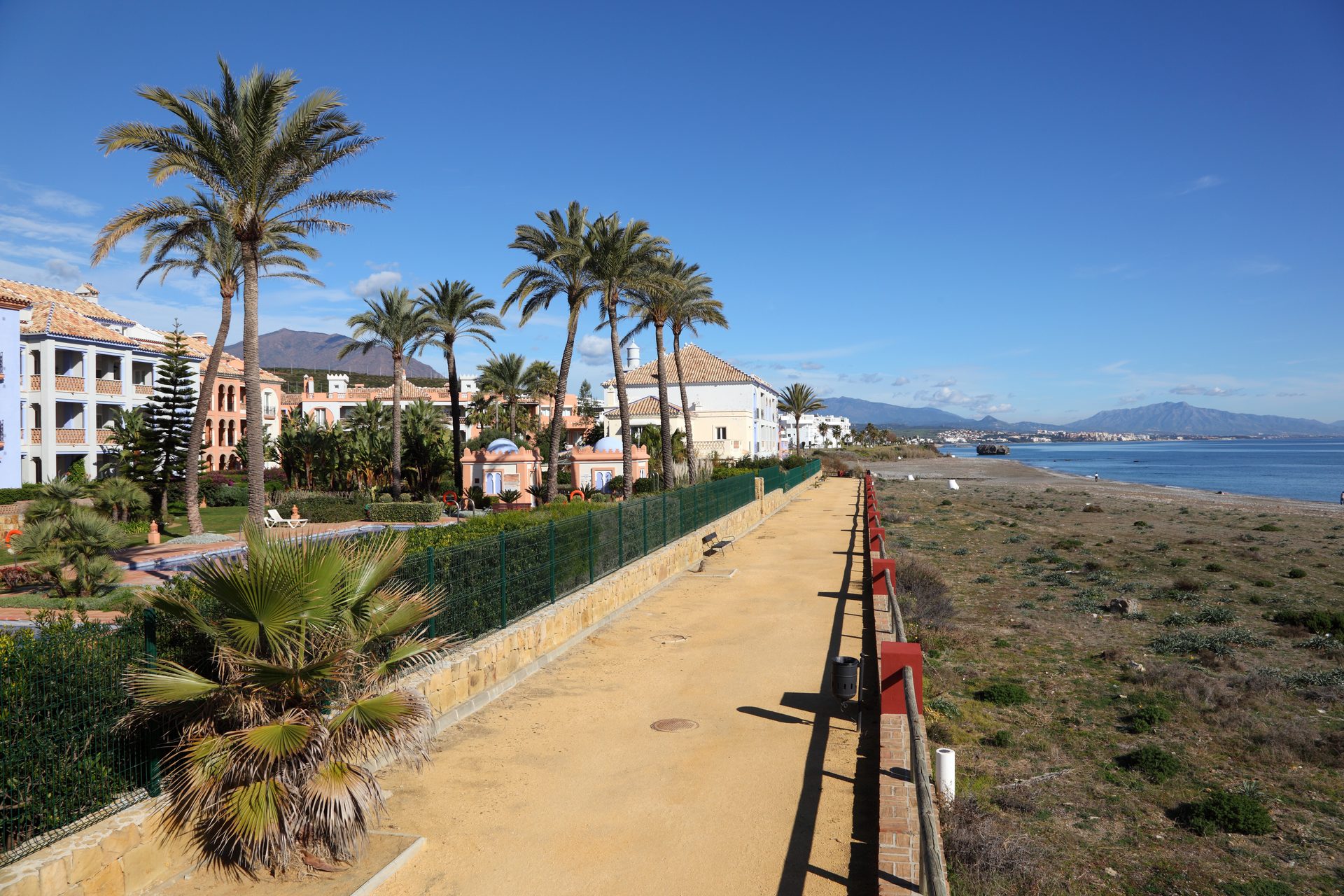 Cozy beachfront apartment with ocean view, balcony, and modern amenities.